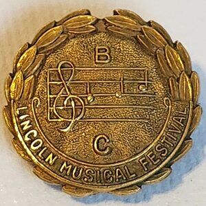 LINCOLN MUSICAL FESTIVAL Pin Gold Tone 1"
